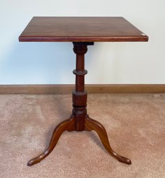 An antique square top cherry Queen