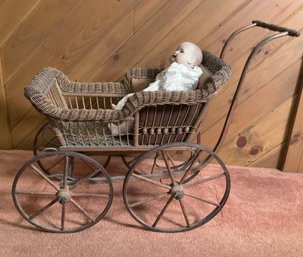 Antique wicker doll’s buggy 29”H
