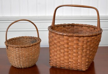 Two antique splint baskets a larger 3062b7