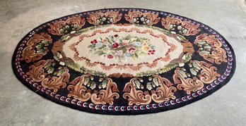 A large vintage oval hooked rug  3062e5