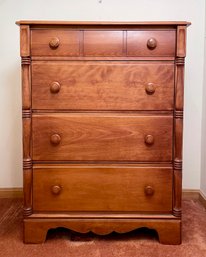 1950s rock maple four drawer chest flanked