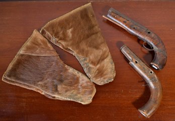 Two antique deconstructed pistols