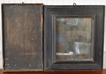 An antique black painted wood mirror 3063d7