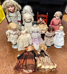 Eleven vintage and antique dolls, including: