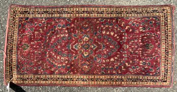 An antique Oriental scatter rug,