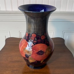 A tall vintage Moorcroft vase with
