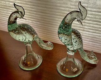 A pair of Murano clear glass peacocks.