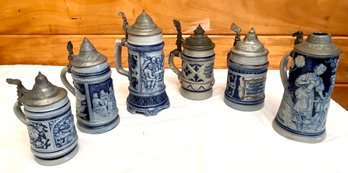 Six antique German steins with