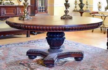 A grand mahogany dining table, a circular