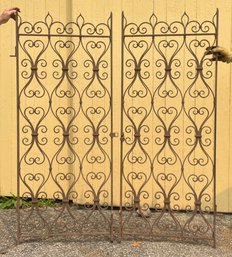 A pair of vintage wrought iron