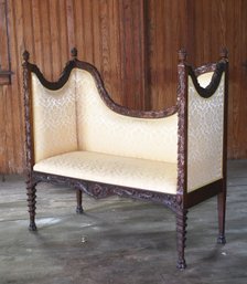 This antique walnut settee is a 306813