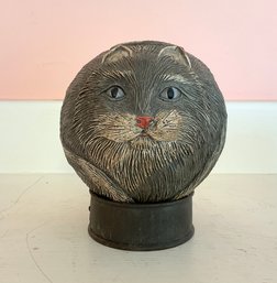 A unique composite ball carving of cat,