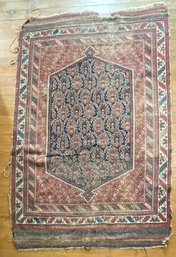 An antique Oriental rug with a
