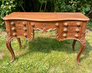 An antique French style mahogany