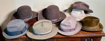 Eight vintage men’s hats, including: