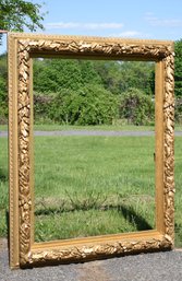 An elaborate gilt and gesso frame