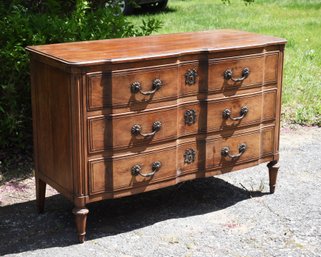 A vintage three drawer French Provincial