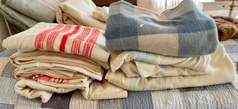 Nine vintage wool blend blankets,