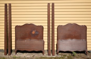 A pair of vintage mahogany bed frames