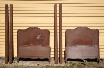 A pair of vintage mahogany bed