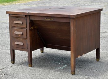 A vintage mahogany H.L. Stearns Desk