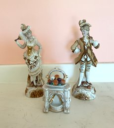 Two 9"H porcelain figurines (elegant