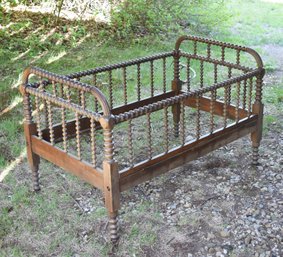 A 19th C. spool turned walnut crib,