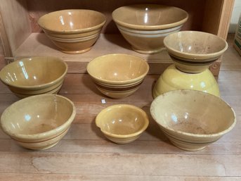 Nine antique yellow ware bowls,