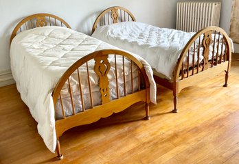 A pair of early 20th C. wood twin beds,