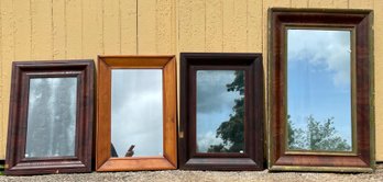 Four antique ‘ogee’ wall mirrors,