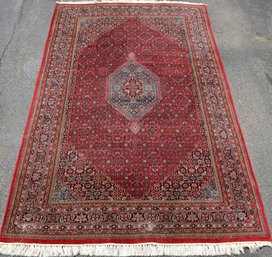 A vintage room size Oriental rug