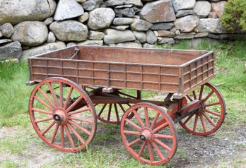 An antique child’s pull wagon with