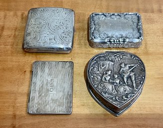 Four antique silver boxes or cases,