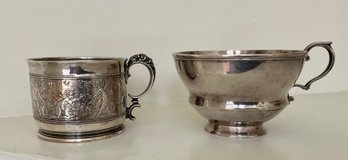 A handled silver mug, with embossed