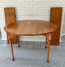 A vintage tiger maple dining table,