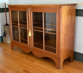 An antique butternut low cupboard  306b27