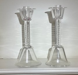 A pair of glass candlesticks with 306b37