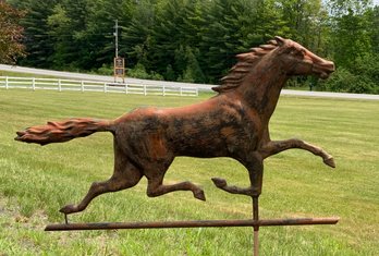 An antique copper running horse weathervane