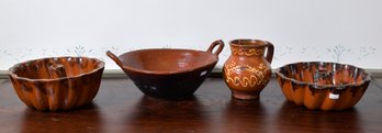 Four pieces of antique redware, including;