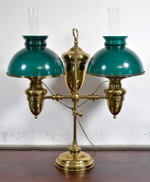 An antique double brass student lamp