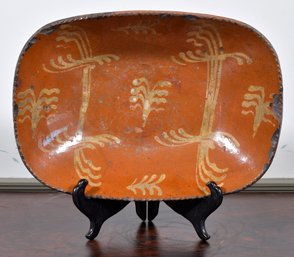 19th C. redware loaf dish with yellow