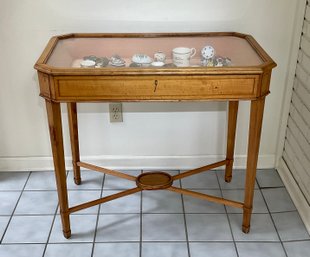 An antique inlaid maple, lift top