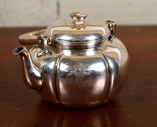 A small vintage teapot with Chinese 306bac