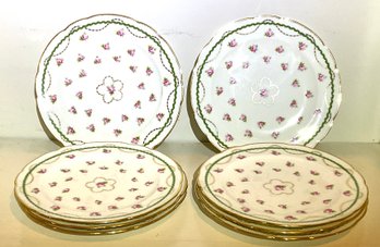 Six slightly scalloped luncheon plates