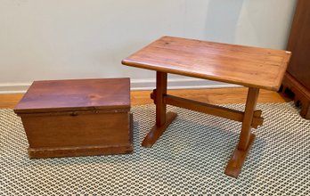 An antique pine shoe foot table