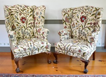 Two antique wing chairs on mahogany 306c2c