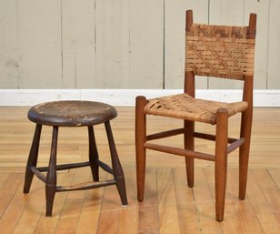 An antique brown painted foot stool