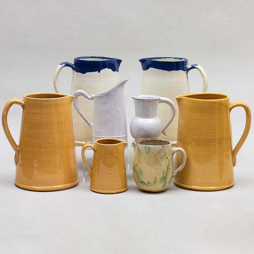 GROUP OF EIGHT GLAZED POTTERY PITCHERSComprising Two 309998