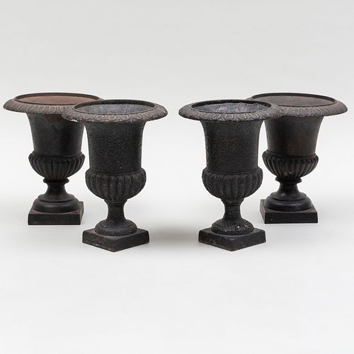 TWO PAIRS OF EBONIZED CAST IRON