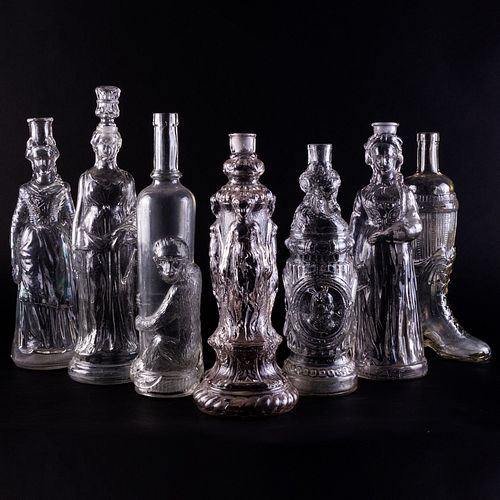 GROUP OF SEVEN FIGURAL GLASS BOTTLESOne 309a31